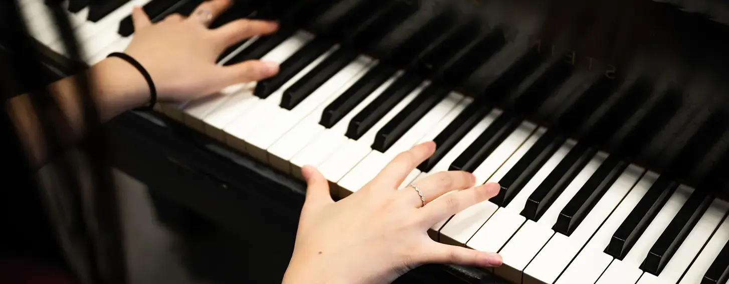 The hands of a musician playing piano.